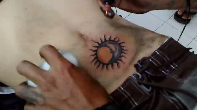 Watch him get a tattoo