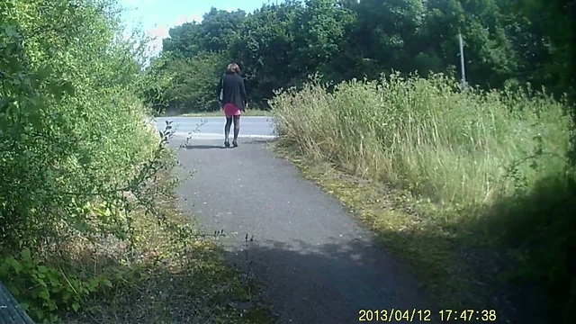 Crossdressed in black stockings in public path by road