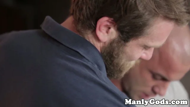 Bearded hunk sucks muscular stud