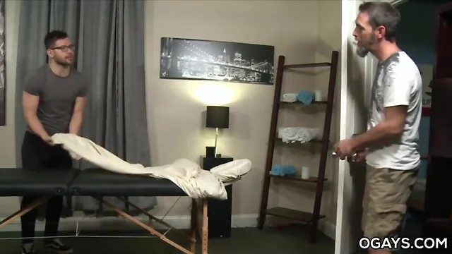 Attractive masseur and her older gay client