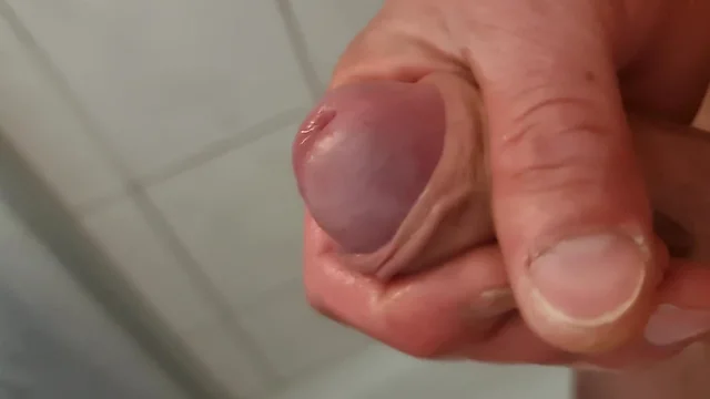 Close-up uncut male masturbation with squirting, peeing, and creamy cumshot
