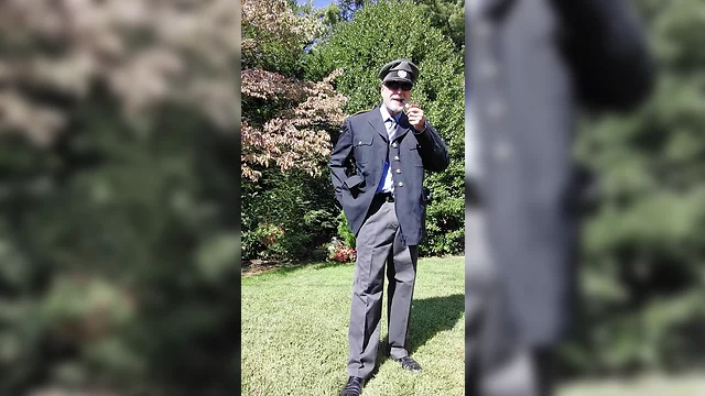 Officer relaxing with pipe on sunny afternoon