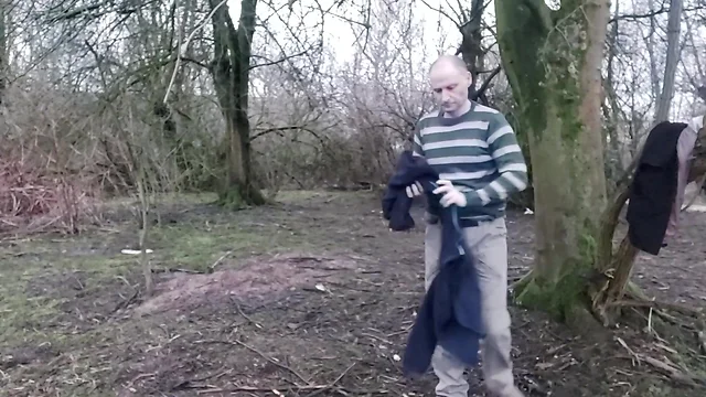 Man masturbates outdoors until he ejaculates.