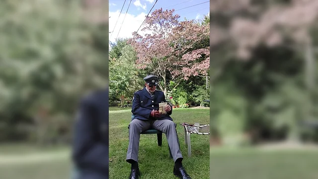 Military officer relaxes with pipe smoking