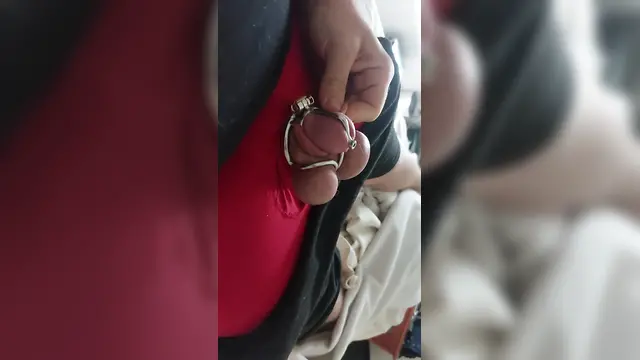 Boy in bondage chastity cage cumming while in permanent ball squeezing chastity