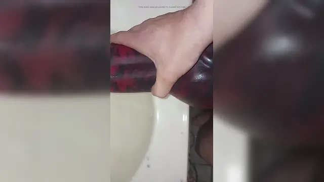 Man engaging in sexual activity with fleshlight