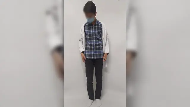 Iranian boy compares clothed and nude body in doctors uniform