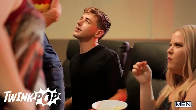 Two straight guys secretly jerk each other’s cocks at the cinema in a steamy twink pop scene