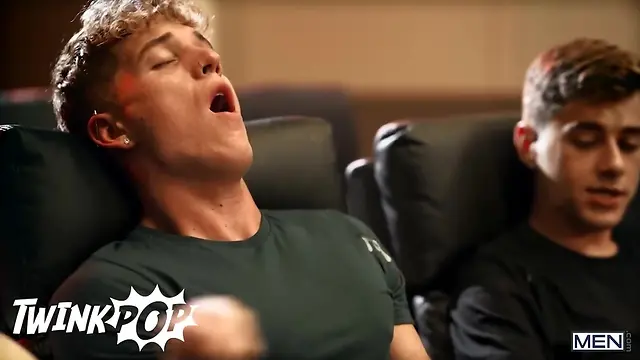 Two straight guys secretly jerk each other’s cocks at the cinema in a steamy twink pop scene